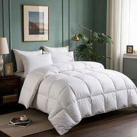 Serta Goose Down Fiber Comforter shown on king bed delivering plush all-season warmth.
