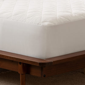 Serta Power Clean mattress pad with stain-release technology to simplify cleaning spills.