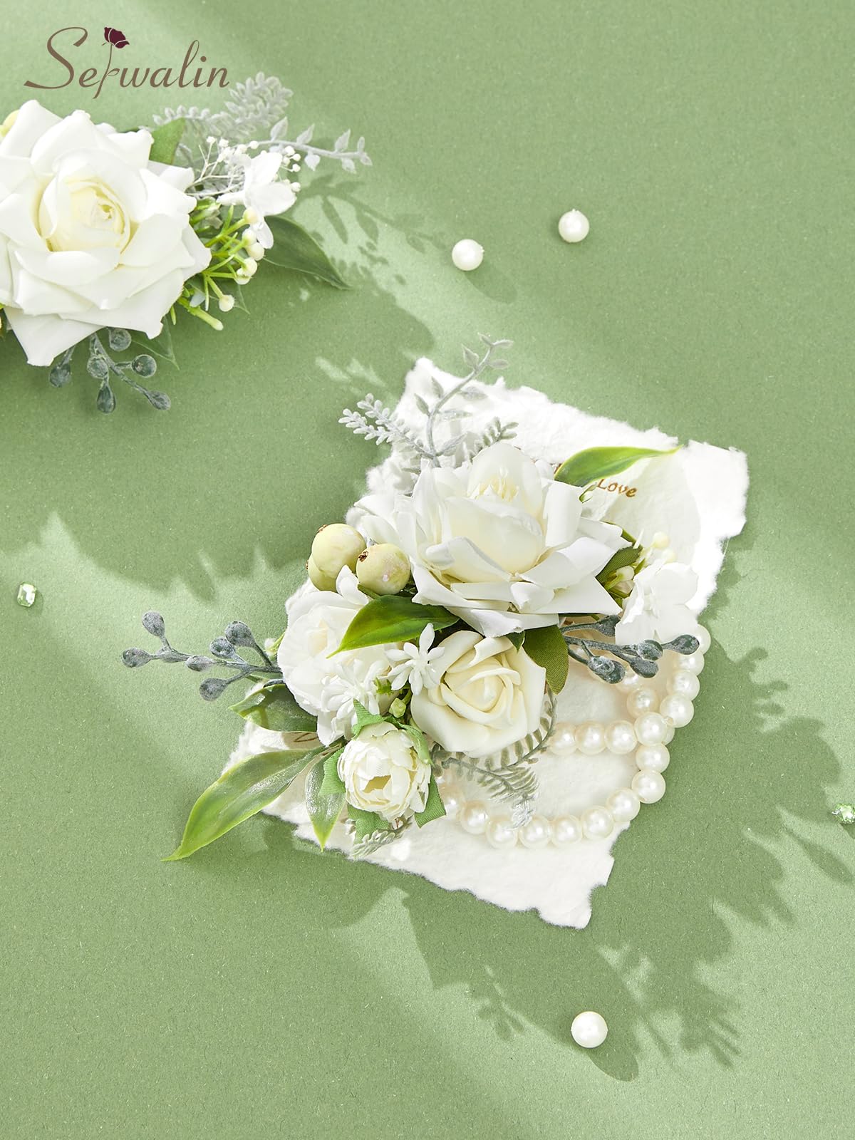 Serwalin corsage boutonniere set displayed together shows coordinated wedding accessories.