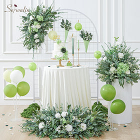Serwalin silver-dollar eucalyptus leaves provide lush texture for arches and vases