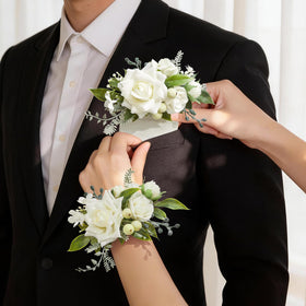 Serwalin white rose wrist corsage demonstrates lifelike silk blooms for lasting elegance.
