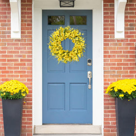 Sggvecsy artificial wreath showcases lush greenery and white berries for year-round charm.