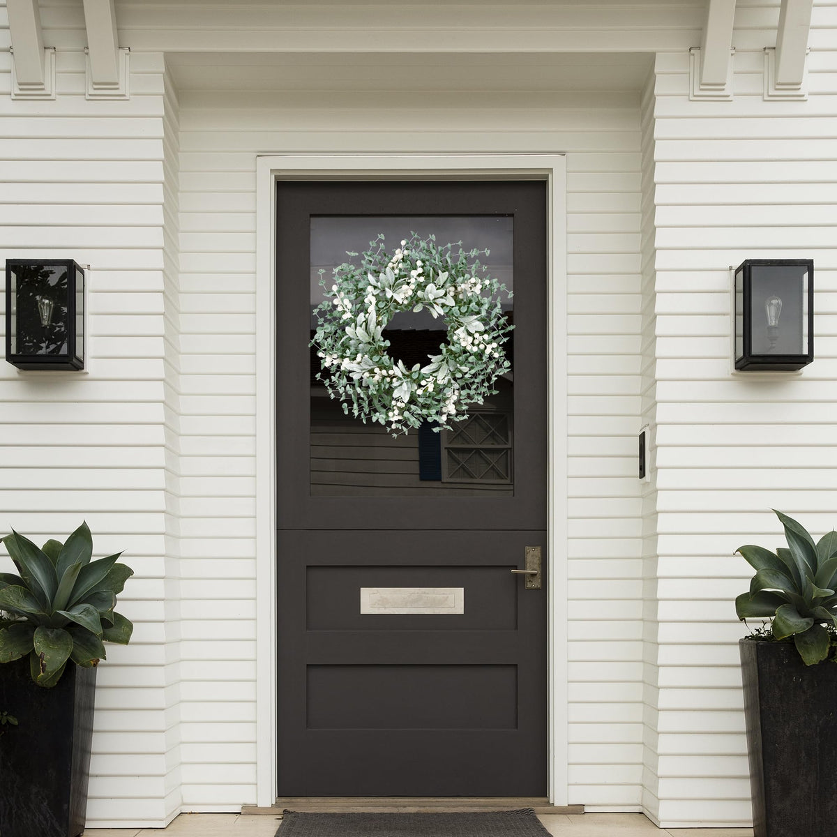 Sggvecsy boxwood wreath with flocked lambs ear and white berries close-up