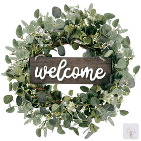 Sggvecsy green eucalyptus wreath with welcome sign on front door adds welcoming natural charm.