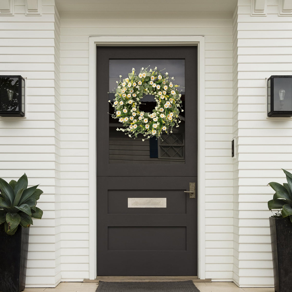 Sggvecsy wreath above fireplace adds cottage-inspired elegance to living spaces.