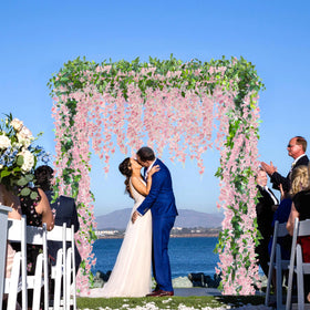 Sggvecsy pink wisteria garland draped on arch for romantic wedding decor