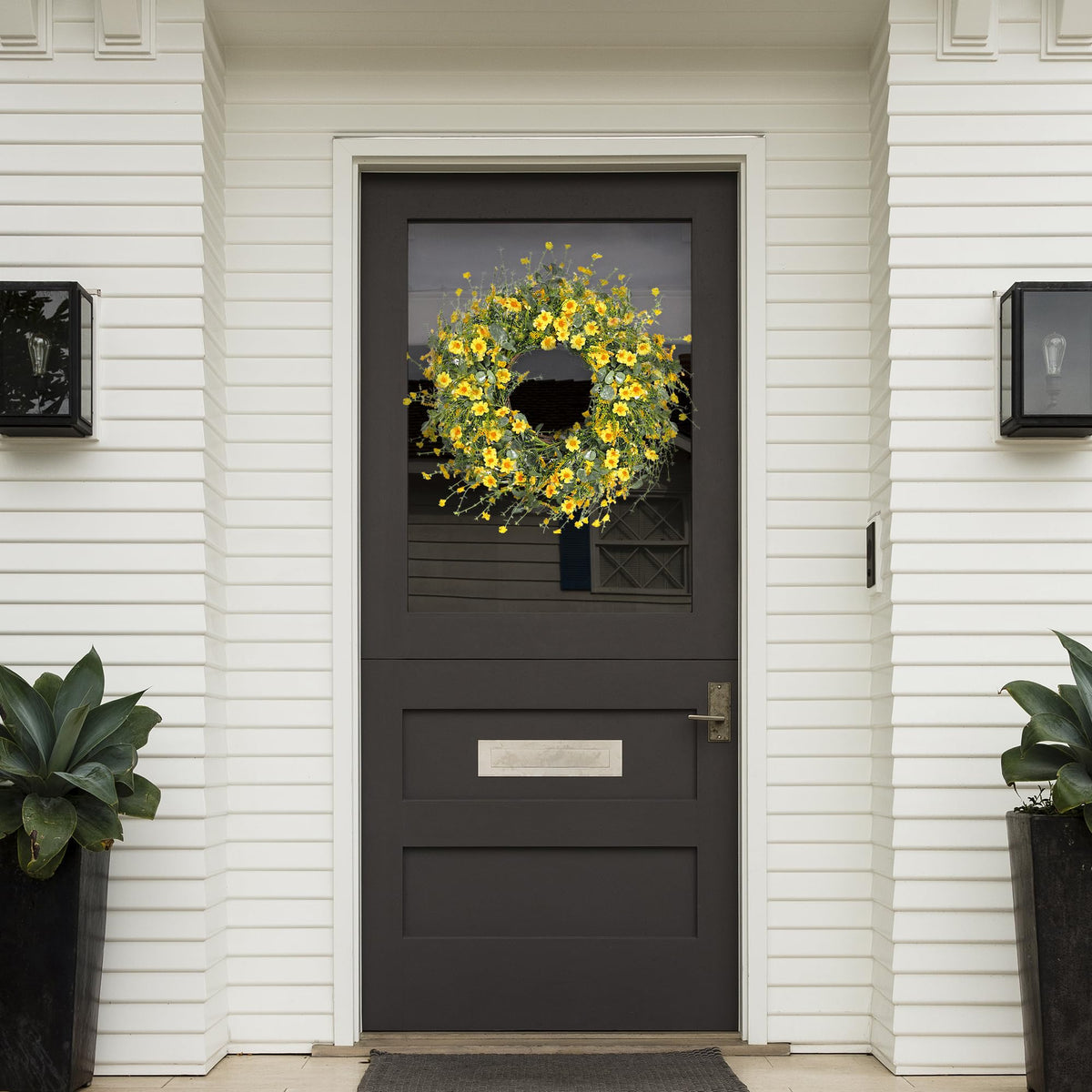 Sggvecsy yellow daisy wreath on fireplace mantel adds springlike warmth.