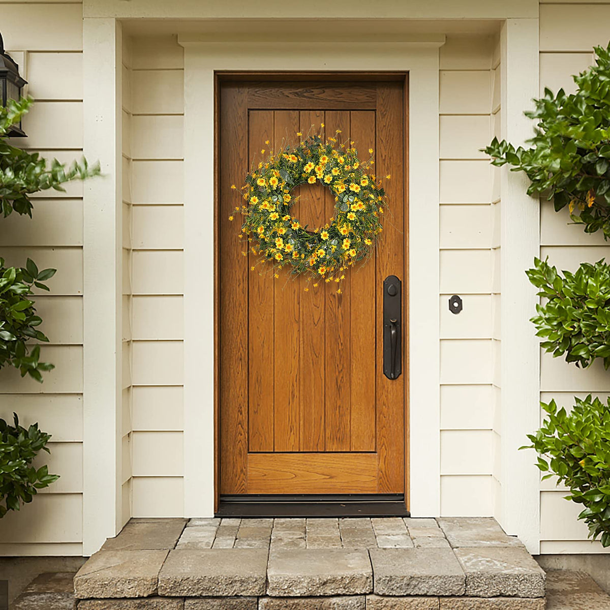 Sggvecsy yellow daisy wreath in a window brightens space for seasonal decor.