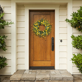 Sggvecsy yellow daisy wreath in a window brightens space for seasonal decor.