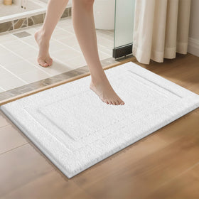 SHACOS rug around tub area, helps keep floors puddle-free after showers