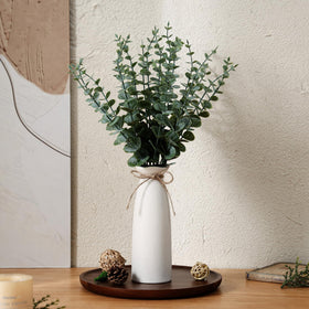 Shanranplus boho centerpiece with artificial eucalyptus stems.