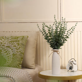 Shanranplus farmhouse style eucalyptus centerpiece on coffee table.