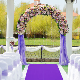 Shappy graduation decor with purple runner adds ceremony flair.
