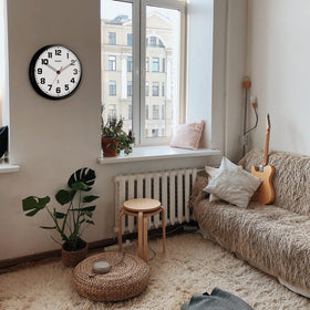 Sharp wall clock ideal for den, kitchen, or workspace.