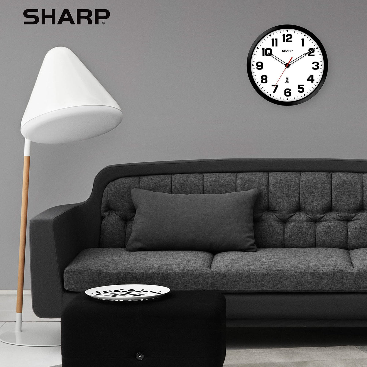 Sharp modern-design wall clock complements office or living spaces.
