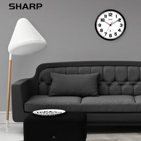 Sharp modern-design wall clock complements office or living spaces.