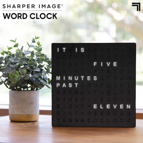 Sharper Image LED Word Clock on desk setup fits a compact workspace