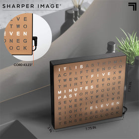 Living room shelf with Sharper Image LED Word Clock adding modern copper accent