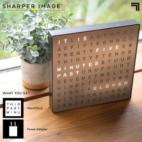 Nightstand scene shows Sharper Image LED Word Clock blending with decor and soft light
