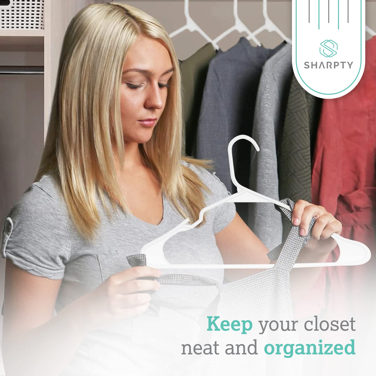 Sharpty plastic hanger with embedded grooves supports belts and scarves without slipping.