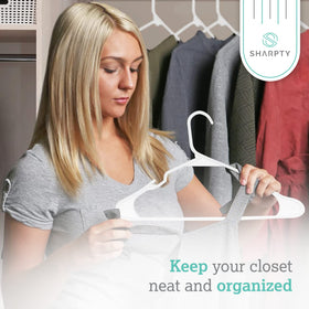 Sharpty plastic hanger with embedded grooves supports belts and scarves without slipping.