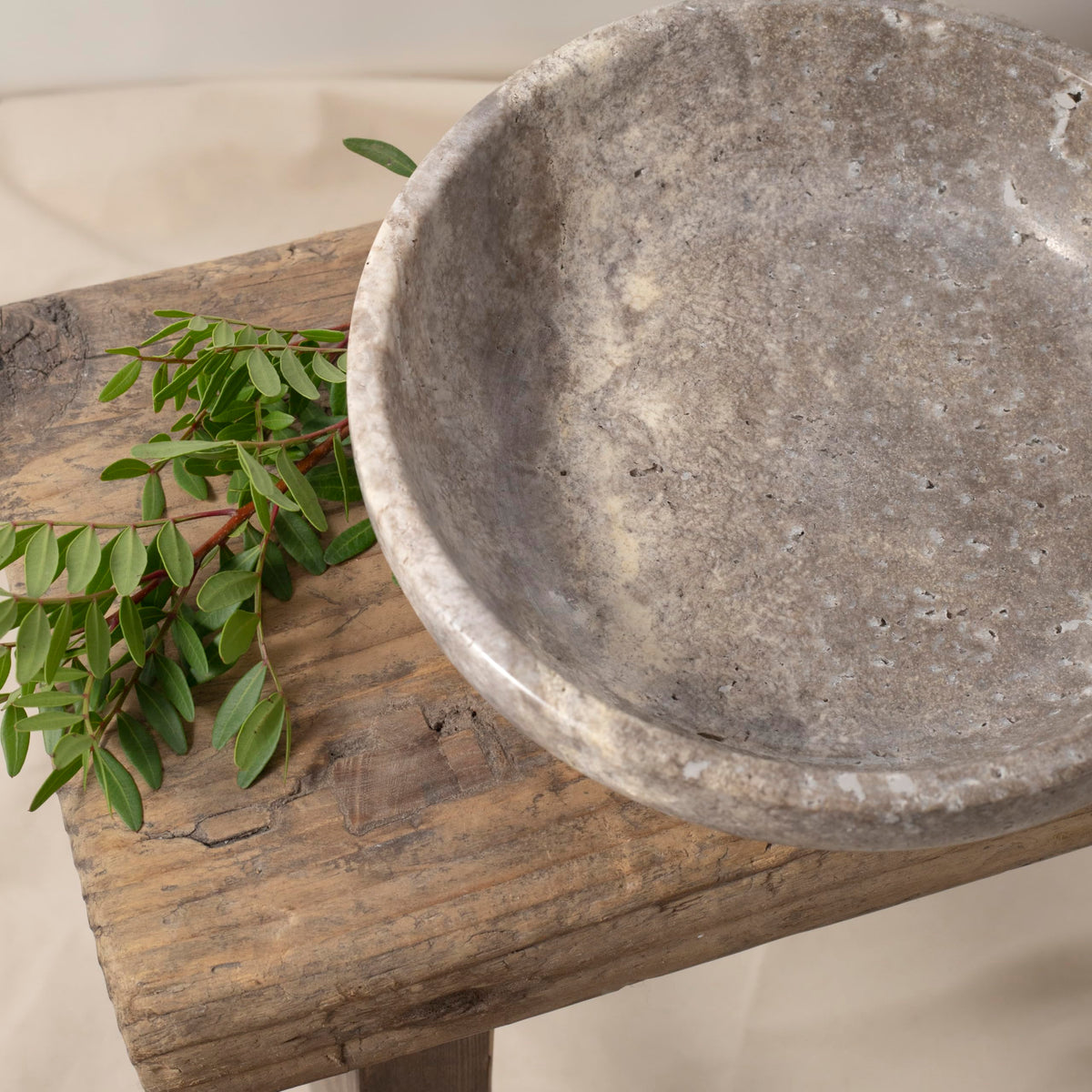 Shelf & Nook travertine bowl used as a potpourri dish in bathroom