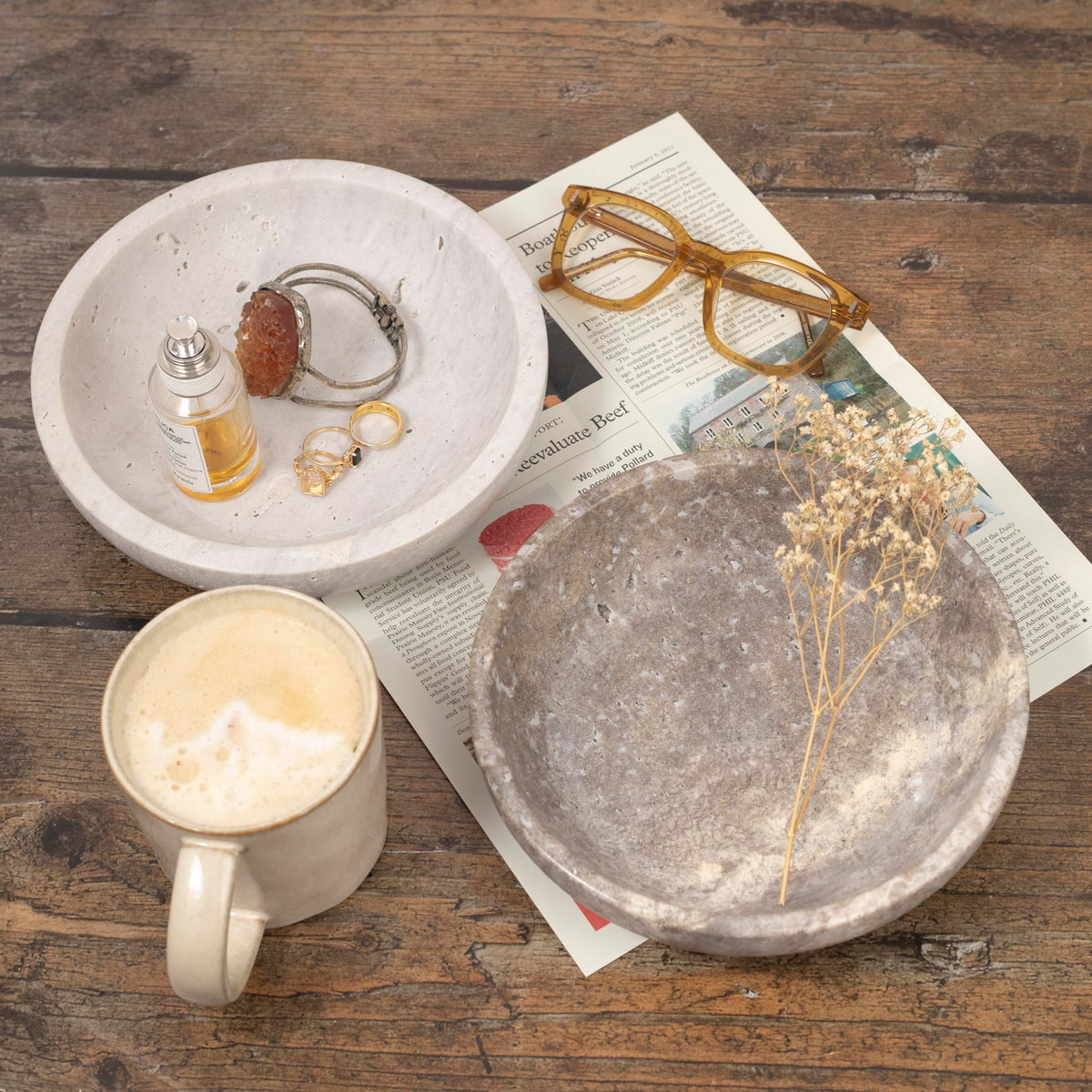 Shelf & Nook travertine bowl on a console table holding coins