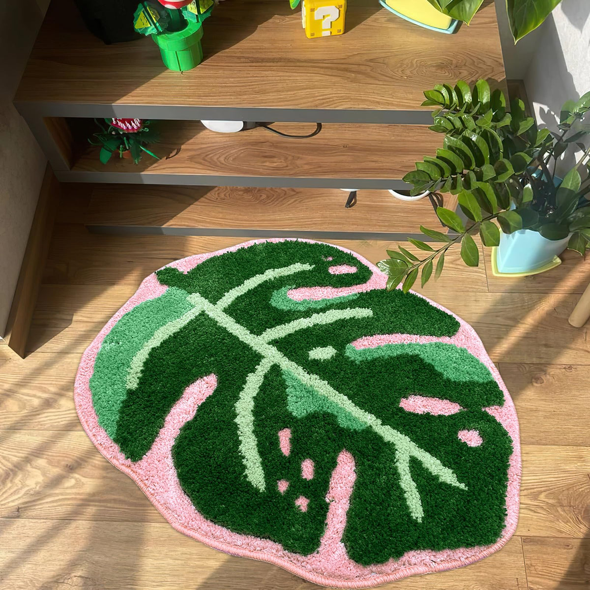Sisher Leaf Rug Monstera bath mat in green and pink adds tropical style.