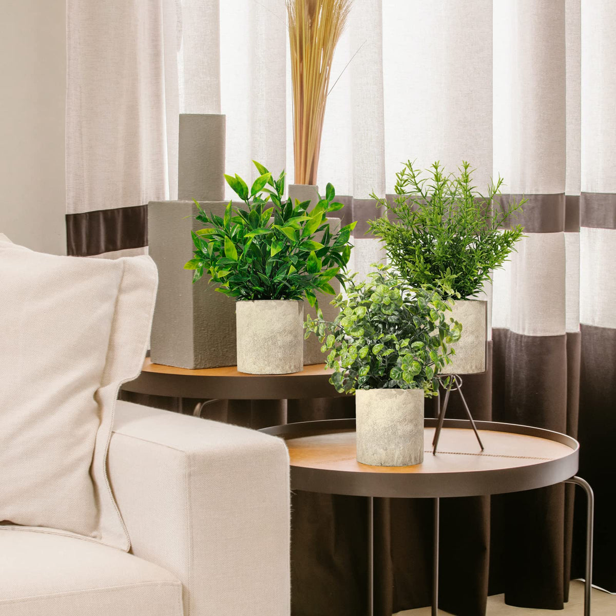 Shohayto artificial boxwood in a macrame hanger enhances walls or shelves with evergreen charm.