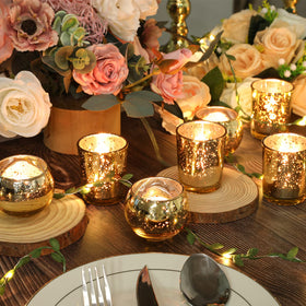 SHOHAYTO gold mercury glass votive reflects candlelight for festive ambiance.