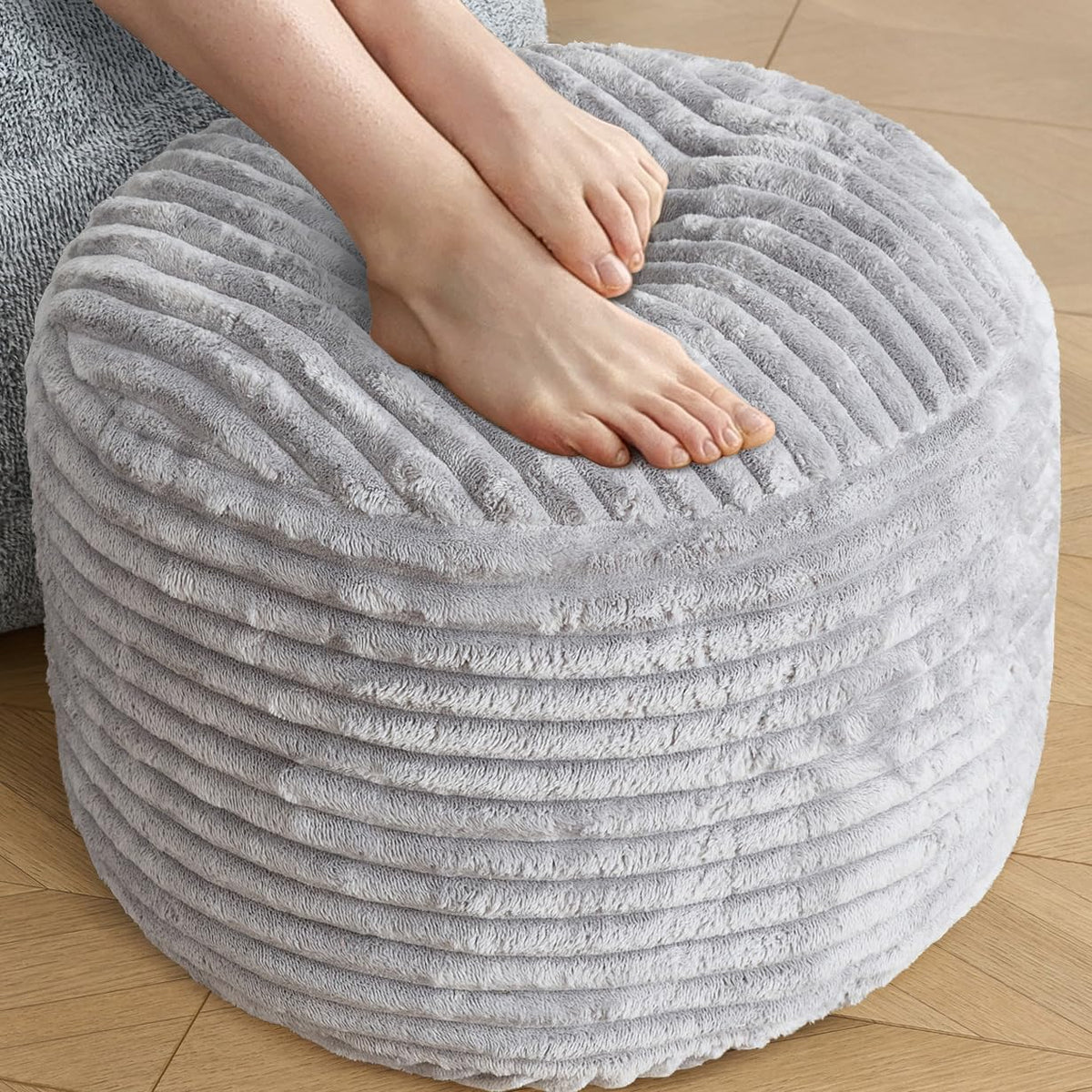 SHOUREN stuffed round ottoman corduroy pouf offers soft cushions for relaxing feet.
