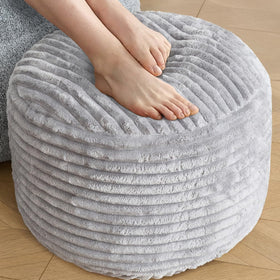 SHOUREN stuffed round ottoman corduroy pouf offers soft cushions for relaxing feet.