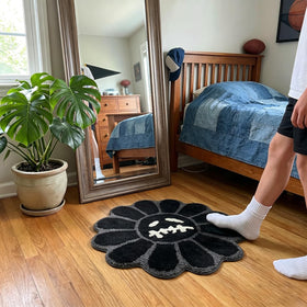 Shovagy Trippy Happy Face Rug is machine washable for easy care.
