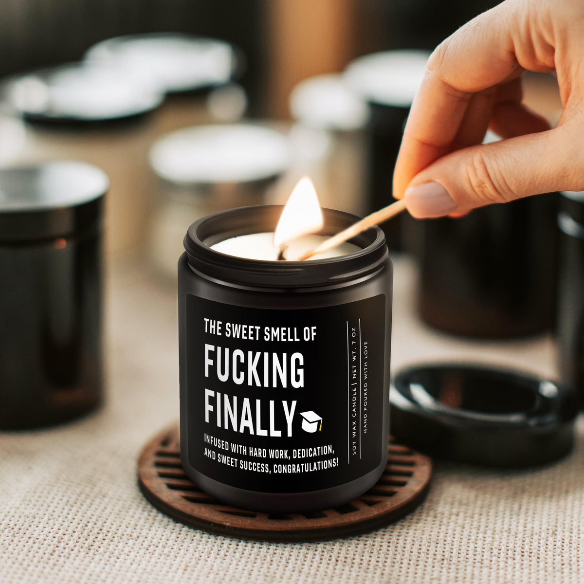 Shqiueos graduation candle jar close-up reveals reusable glass container.