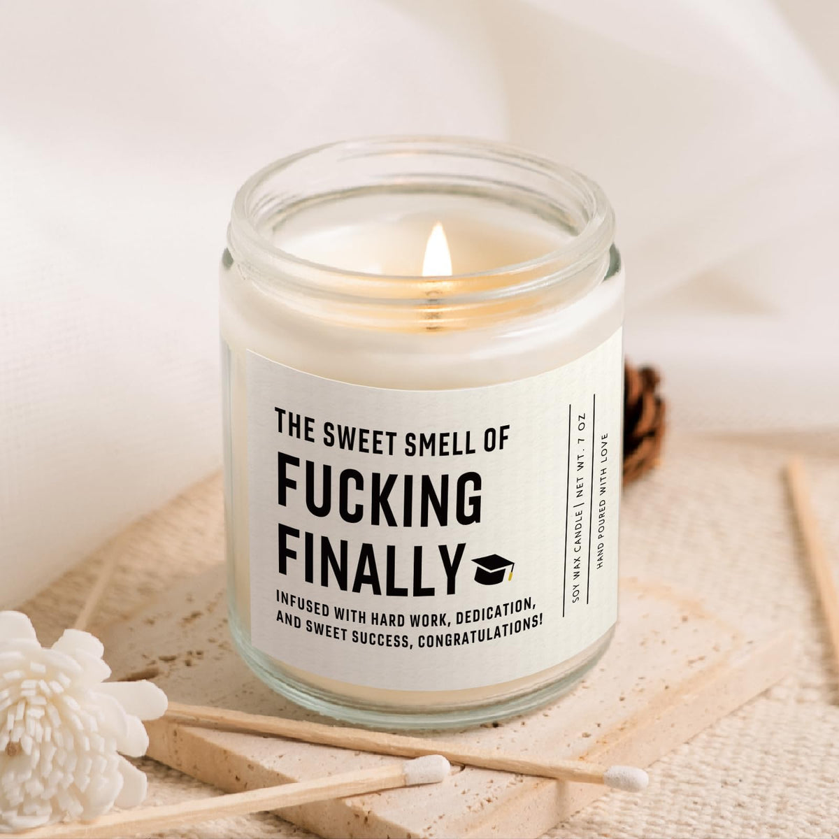 Shqiueos soy wax candle in a reusable glass jar.