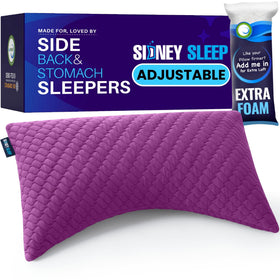 Sidney Sleep 19x29 pillow sits on a bed for versatile nightly use.