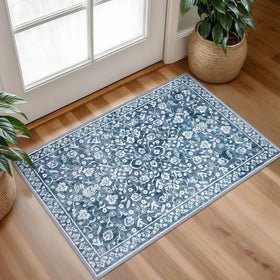 SILOLOOM Vintage entryway rug close-up shows blue floral pattern for classic charm.
