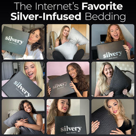 Silvery bed sheets on a bed with pillows for premium comfort
