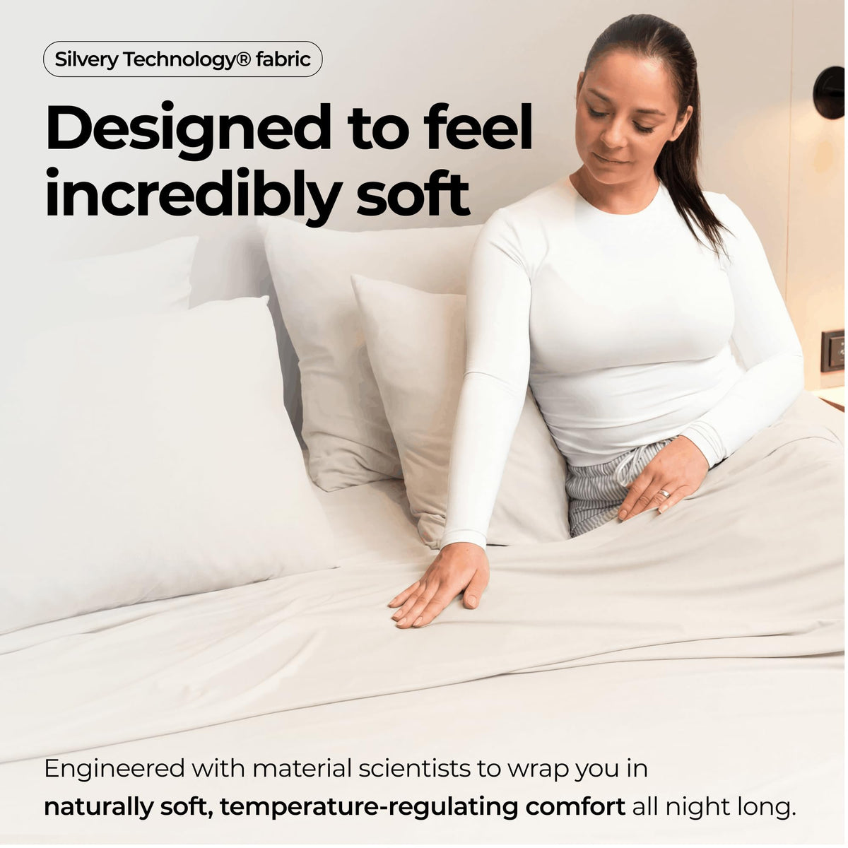 Silvery bed sheets with a soft silky finish conveying luxury feel.