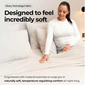 Silvery bed sheets with a soft silky finish conveying luxury feel.