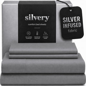 Silvery silver-infused bed sheets folded on bed, highlighting ultra-soft texture and lasting freshness.