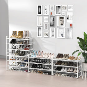 Simple Houseware white rack stacks sneakers neatly, maximizing closet organization.