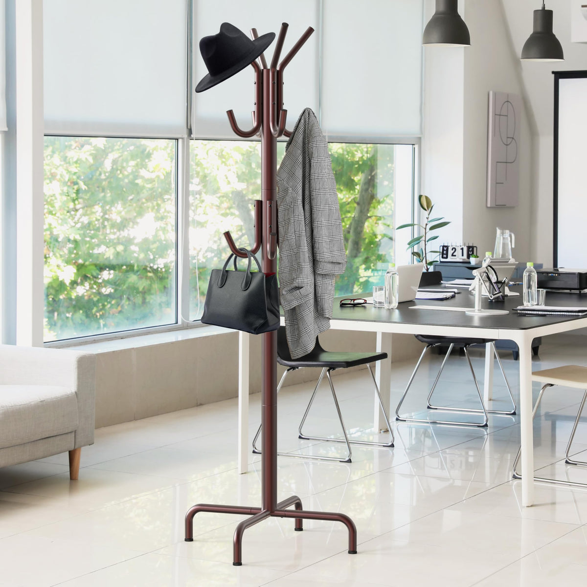 Simple Houseware adjustable glides on the coat hanger help level on uneven floors.