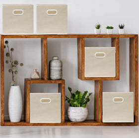 Beige fabric cube bin unfolded shows sturdy 11 inch size for shelves.