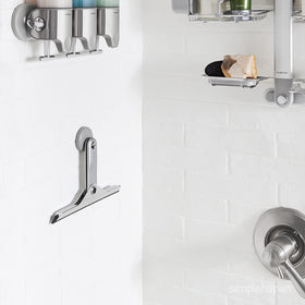 Simplehuman foldaway squeegee folded-storage saves bathroom space.