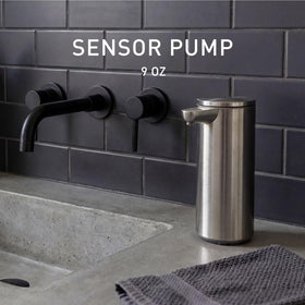 Simplehuman pump side view in brushed stainless steel showing pour nozzle and drip free design