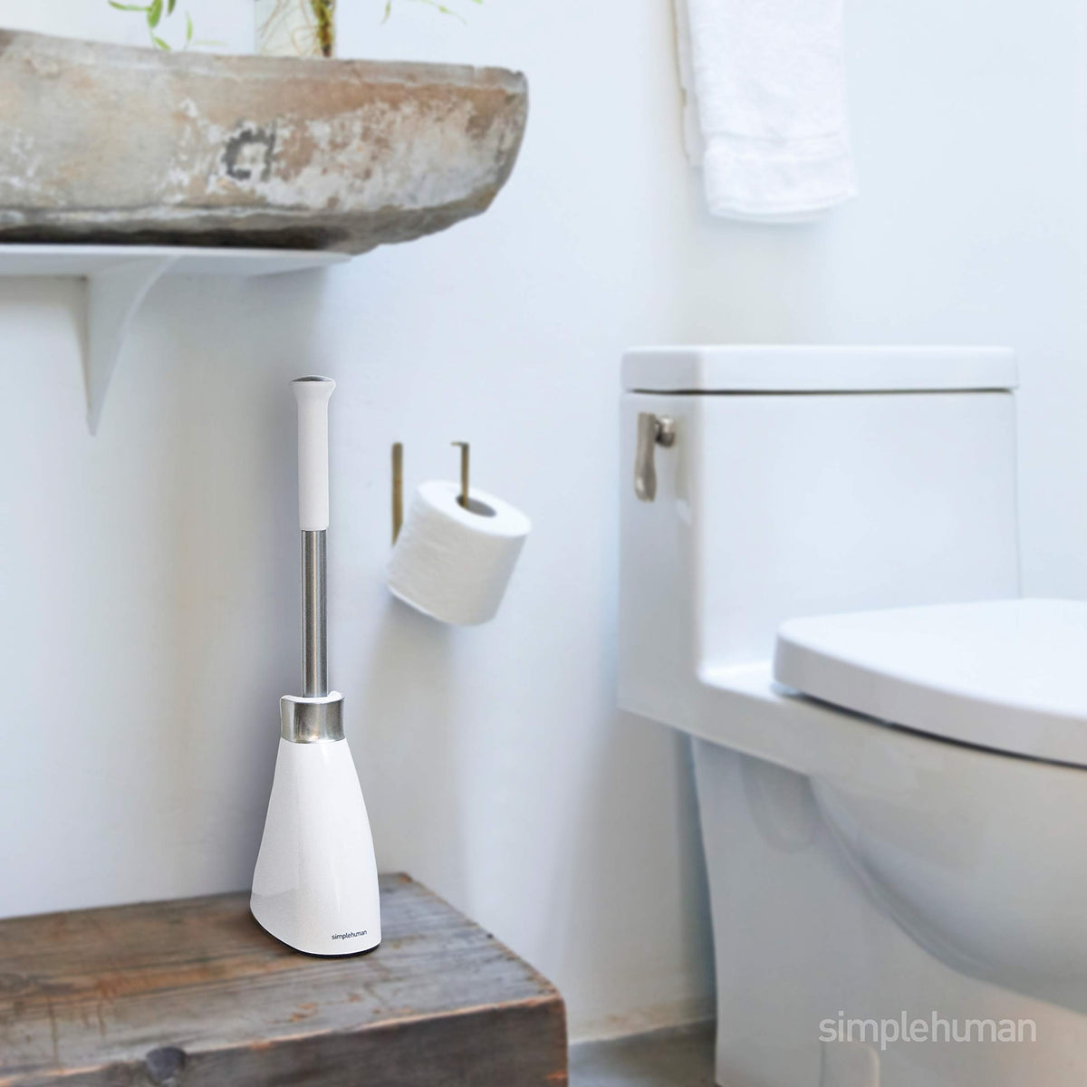 Simplehuman toilet brush with cover protects bristles and maintains a neat look.