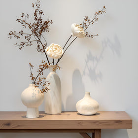 SincereLuxe vase set on a shelf with ivory textured round detail for neutral decor.