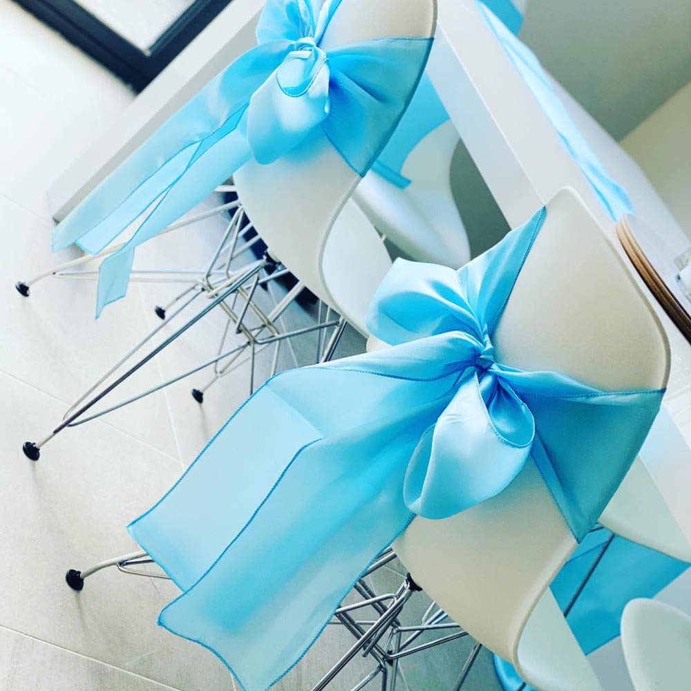 Elegant wedding decor with SINSSOWL sash enhancing seating and aisle.