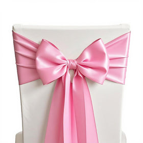 SINSSOWL pink satin chair sash on wedding setup adds elegant color.
